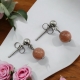 Boucles Oreilles puce en inox ornées d'une pierre de Soleil