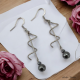 Boucles Oreilles Torsade inox ornées d'Hématite